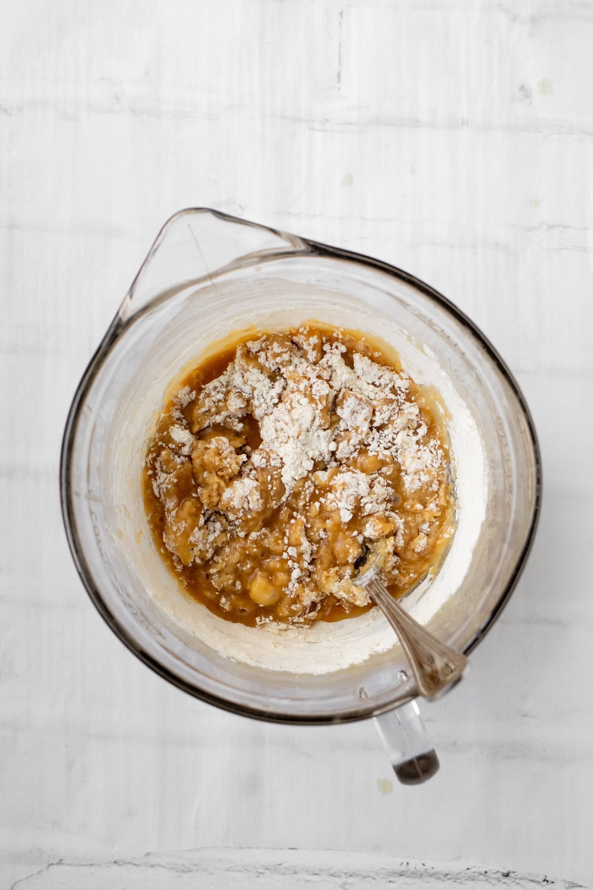flour being mixed into blondie batter.