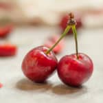 a pair of cherries joined at the top