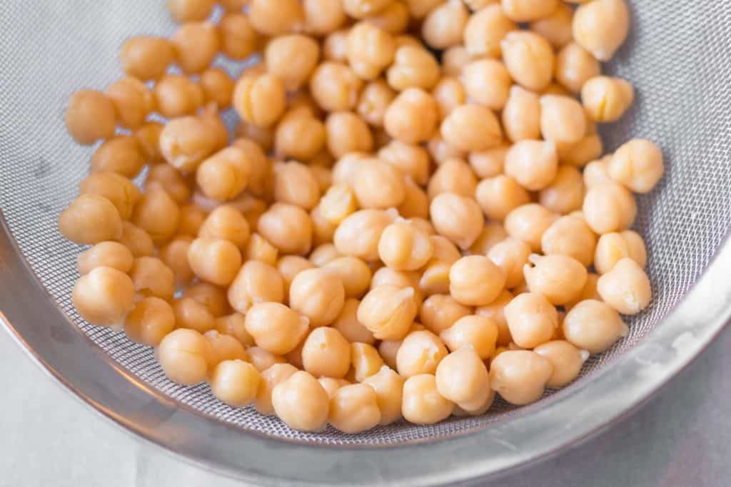 chickpeas in a metal mesh strainer