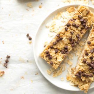 two simple granola bars with chocolate chips on a white plate