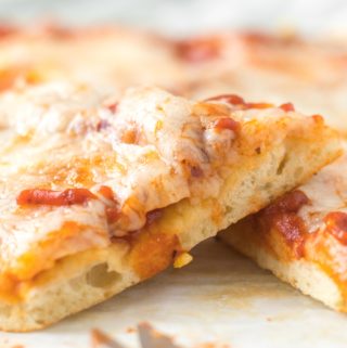 side view of a square slice of pizza