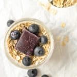 overnight oats with blueberry puree and whole blueberries on top