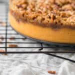 side view of sweet potato pie on cooling rack