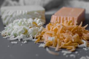 grated cheese on a cutting board