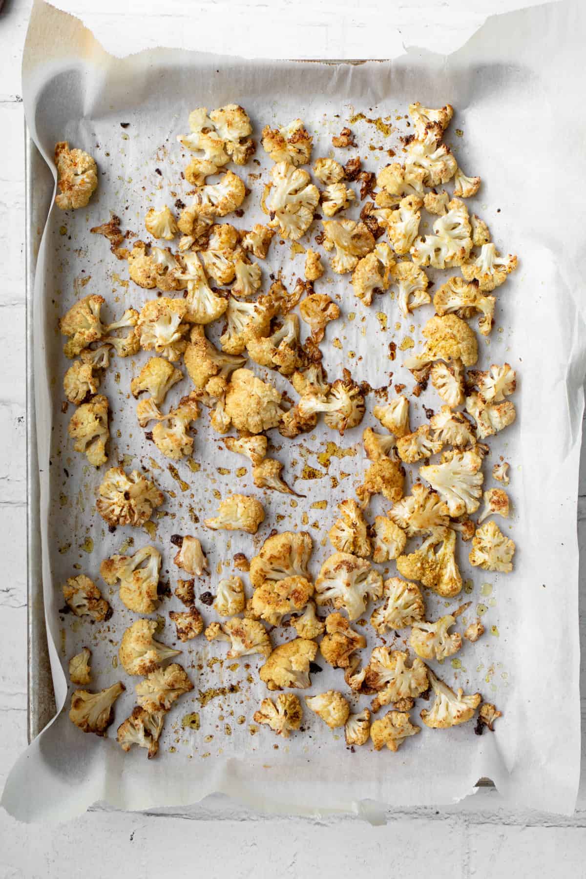 roasted cauliflower on a baking sheet just out of the oven.