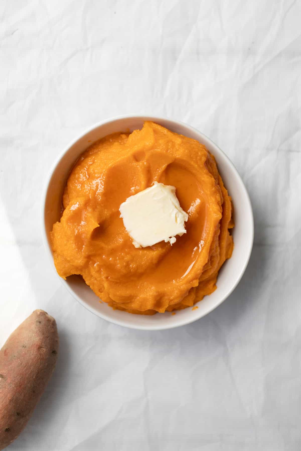 sweet potato puree with a pat of butter and maple syrup.