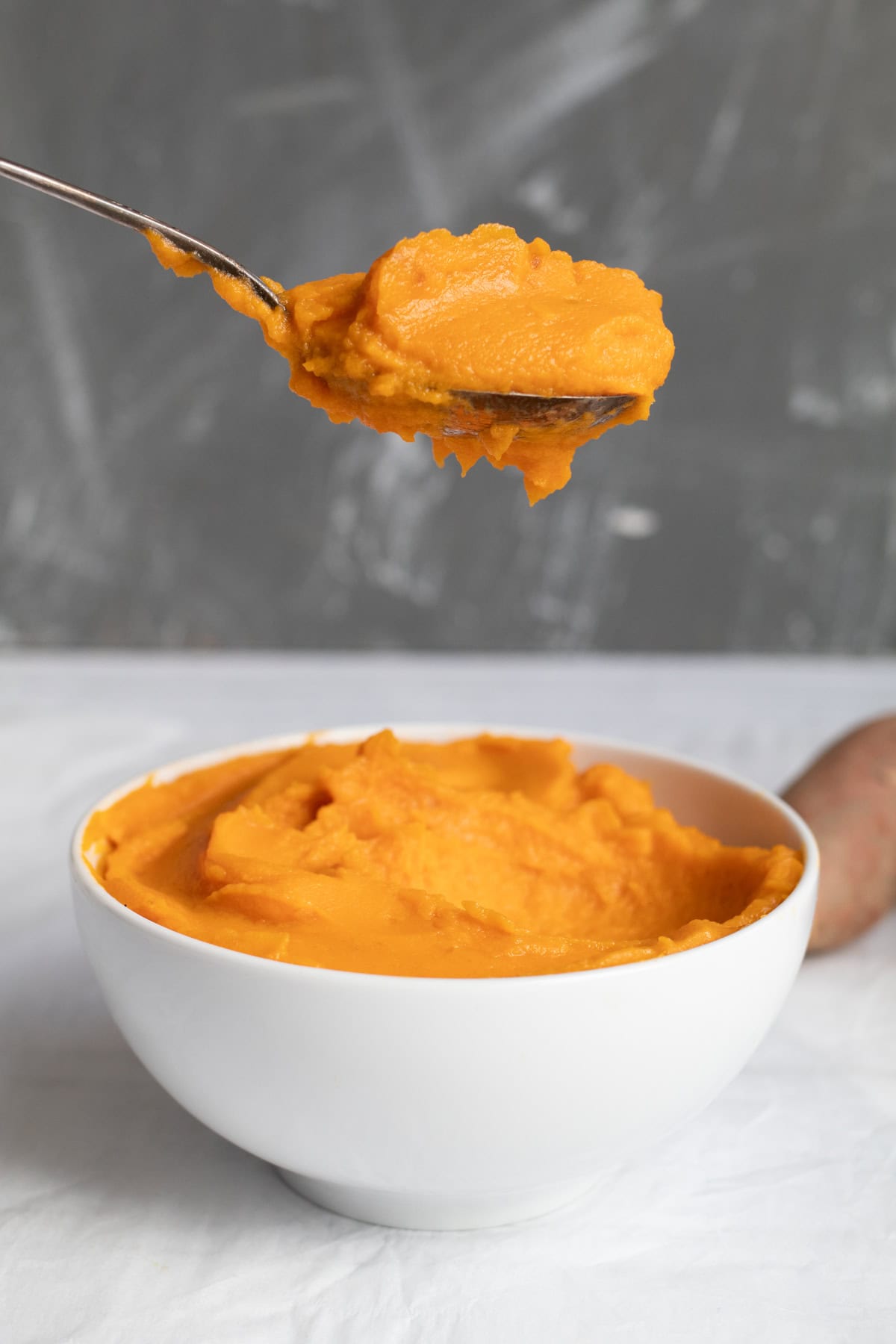 sweet potato puree on a spoon.