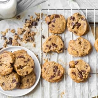 chocolate coffee chunk cookies on a cooling rack and small plate