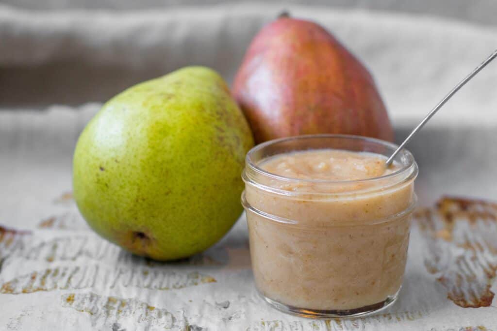 pear puree with a green and red pear