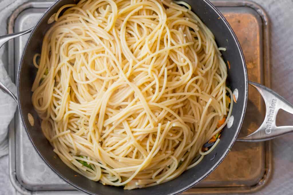 spaghetti noodles in a pan for lo mein