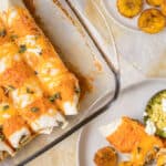 enchiladas in a glass pan with one on a plate