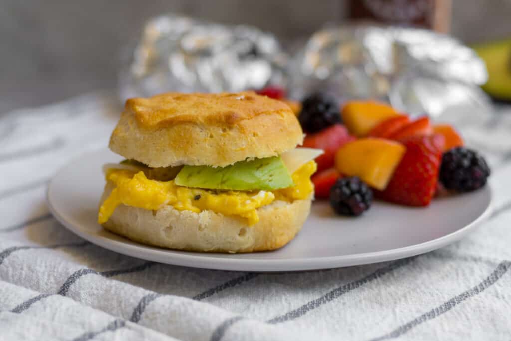 egg and cheese sandwich with avocado on a plate