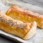 two bourekas ready to cut on parchment paper