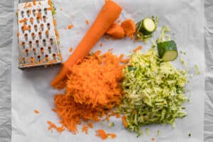 grated carrots and zucchini with a box grater