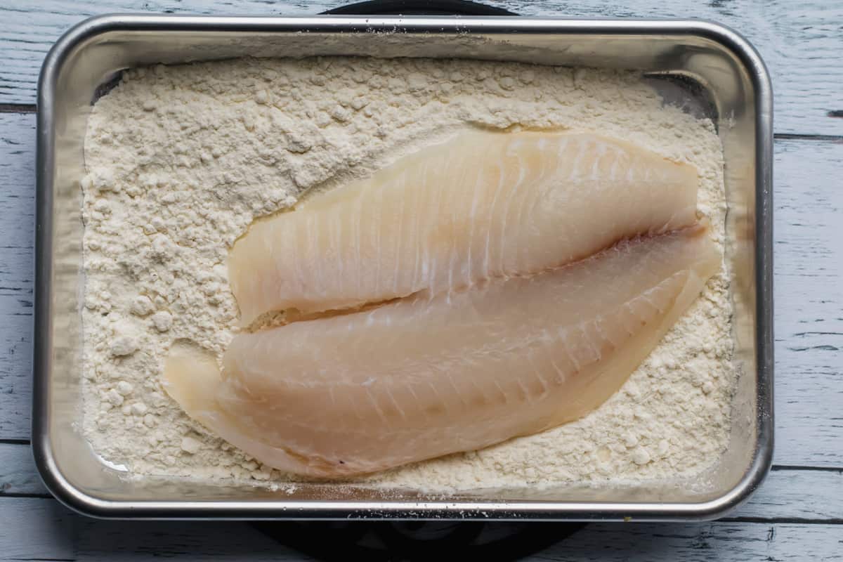 fish being dredged in flour
