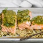 pesto salmon pieces on a bed of wild rice