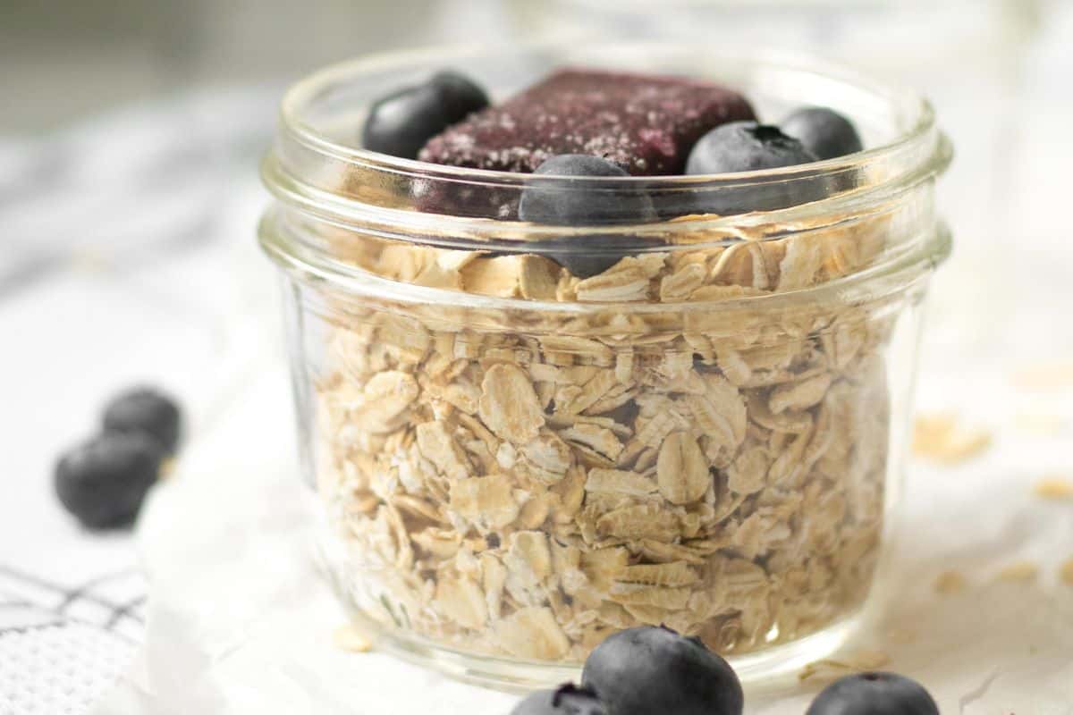 blueberry overnight oats with whole blueberries on the side