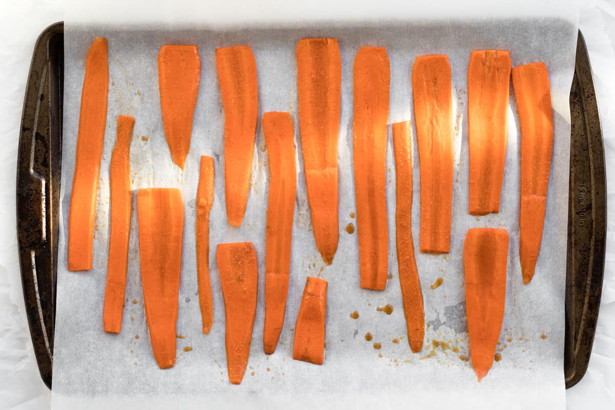 carrots on a baking tray with parchment paper