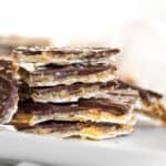 matzo crack stacked on a white plate