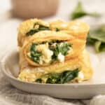 spinach and feta omelette stacked on a plate