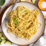 spaghetti noodles with creamy zucchini sauce on a plate