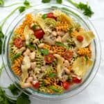 zesty italian pasta salad in a glass bowl.