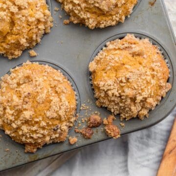 pumpkin muffins in a muffin tin.
