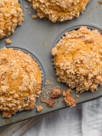 pumpkin muffins in a muffin tin.