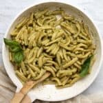 creamy pesto pasta in a white pan