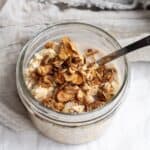 vanilla overnight oats in a mason jar with a spoon