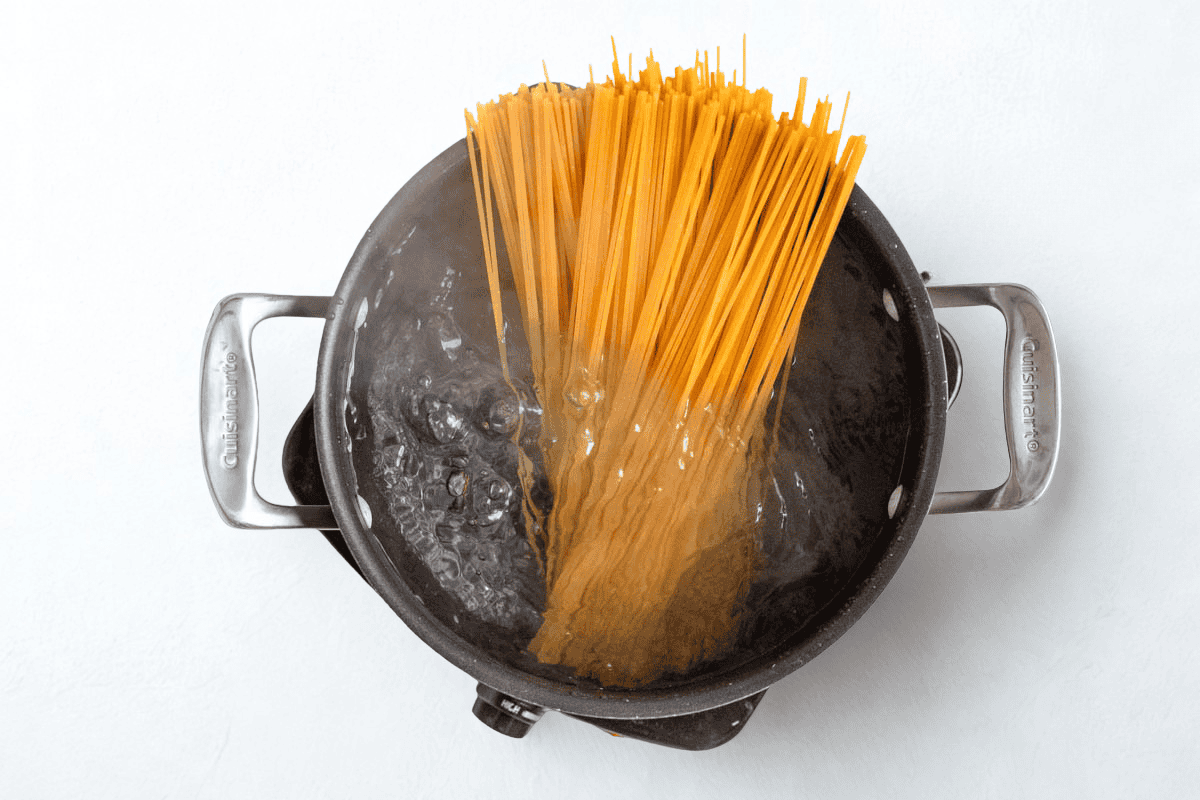 pasta going into boiling water.