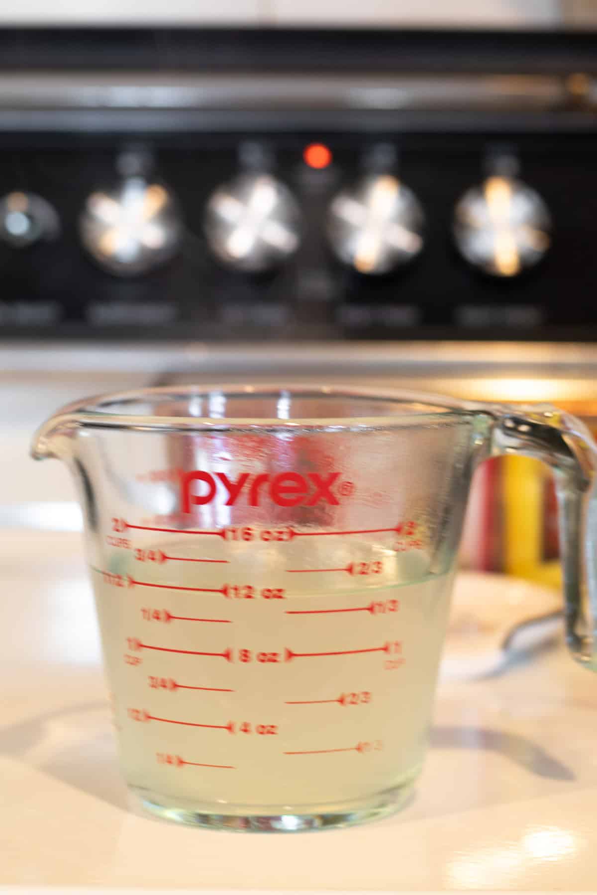 pasta water in a measuring cup.