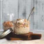 carrot cake overnight oats in a mason jar with a spoon