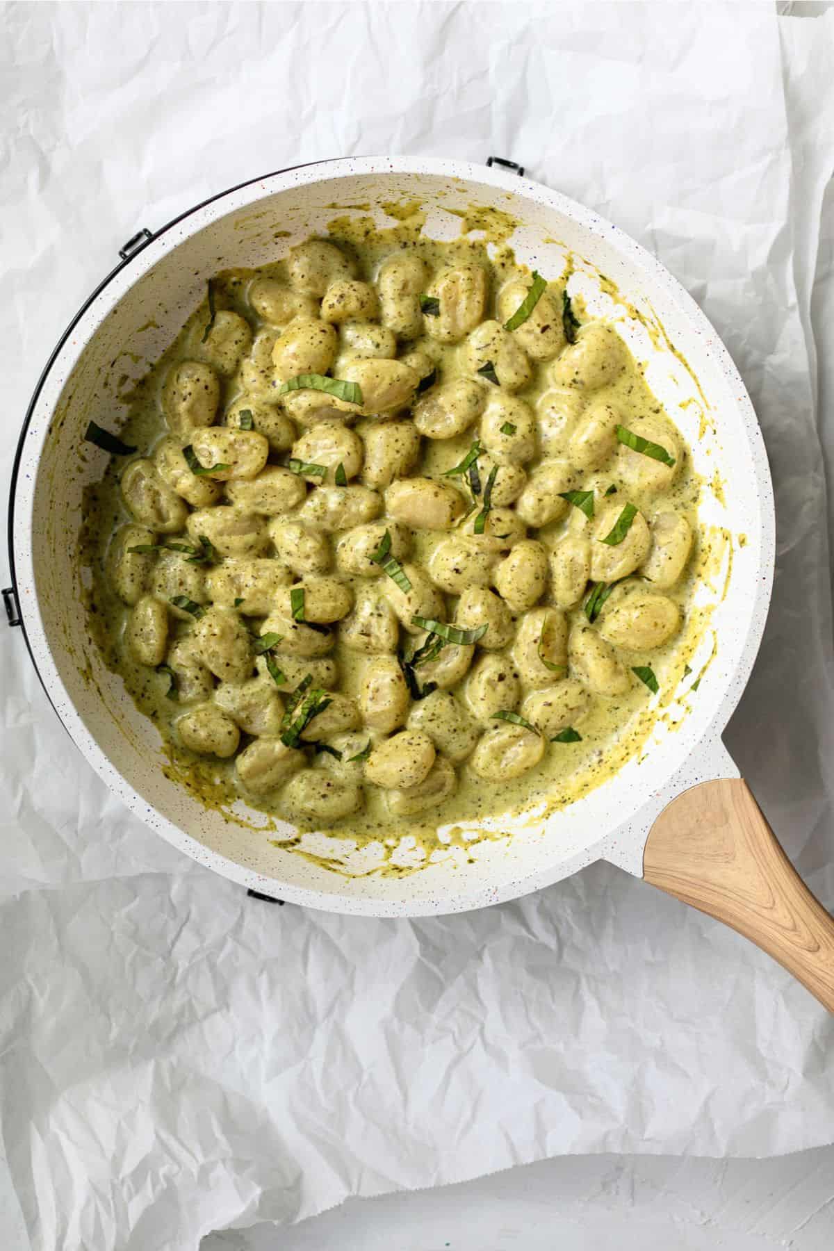 gnocchi with pesto in a pan ready to serve