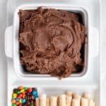brownie dip with add-ins and dippers on a platter