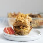 pieces of apple kugel stack with sliced apples