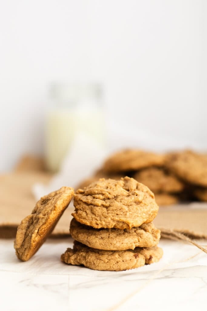 spice cake cookies stacked on parchment paper