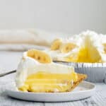 banana pudding pie slice on a white plate