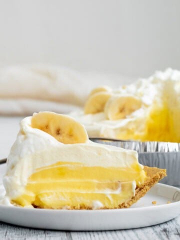 banana pudding pie slice on a white plate