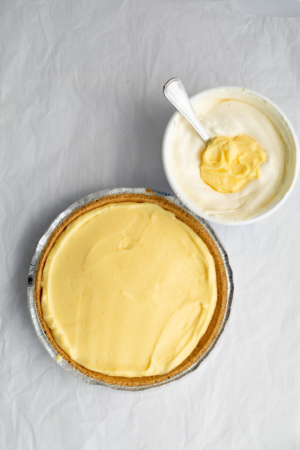 banana cream pie with pudding being folded into cool whip
