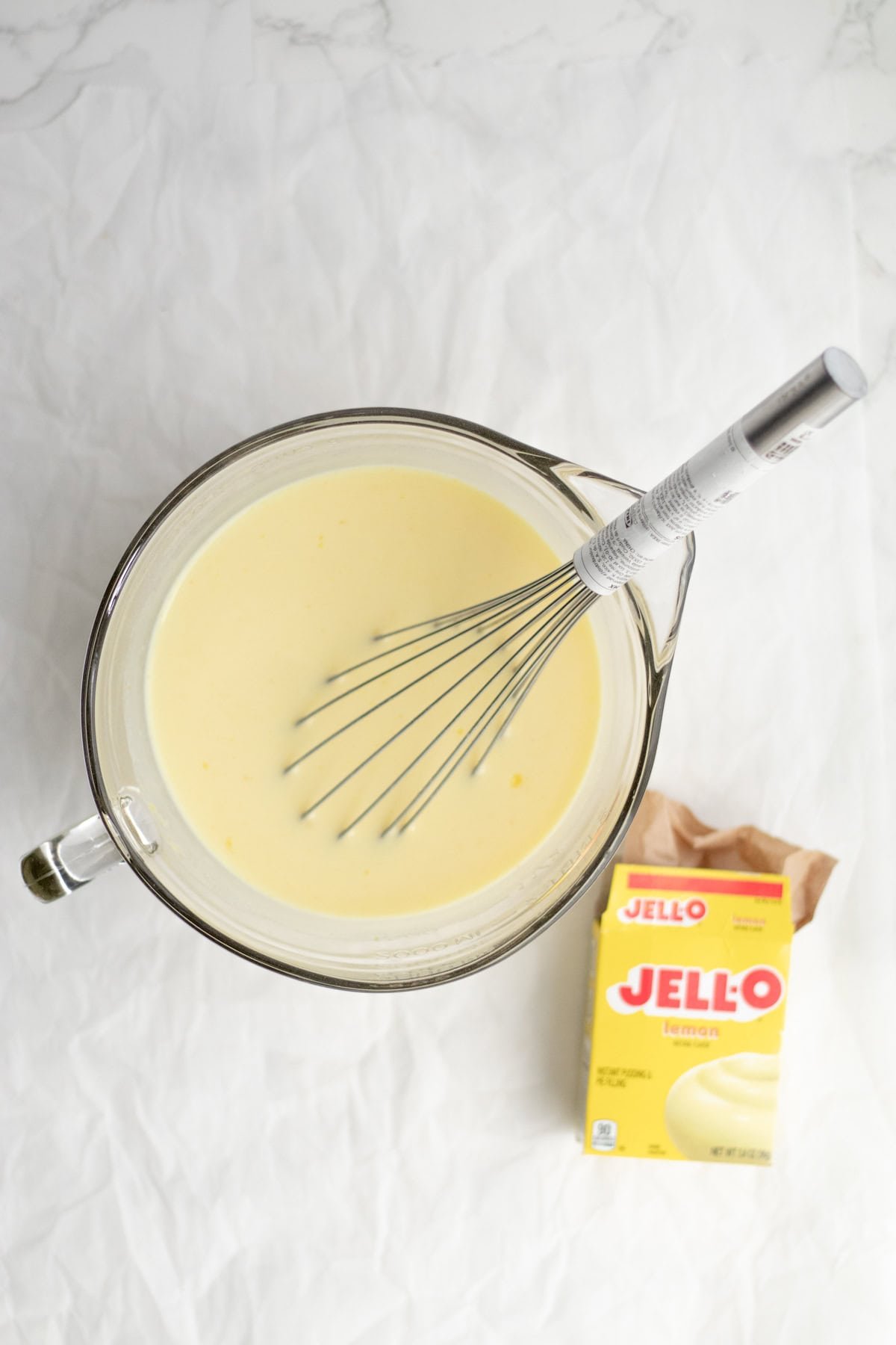 mixing pudding in a glass bowl