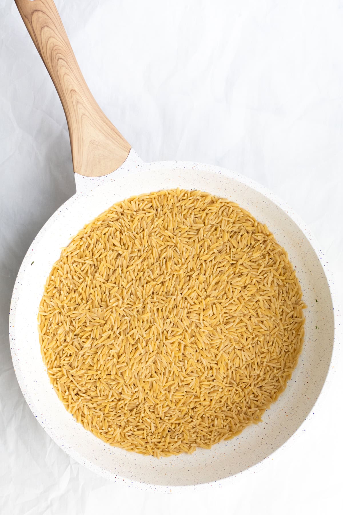 orzo toasting in a pan