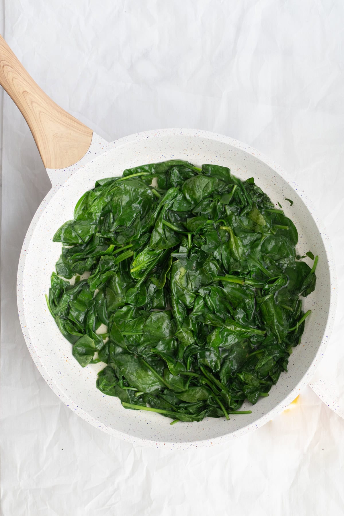 wilted spinach in a pan