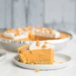 piece of butterscotch pudding pie on a white plate