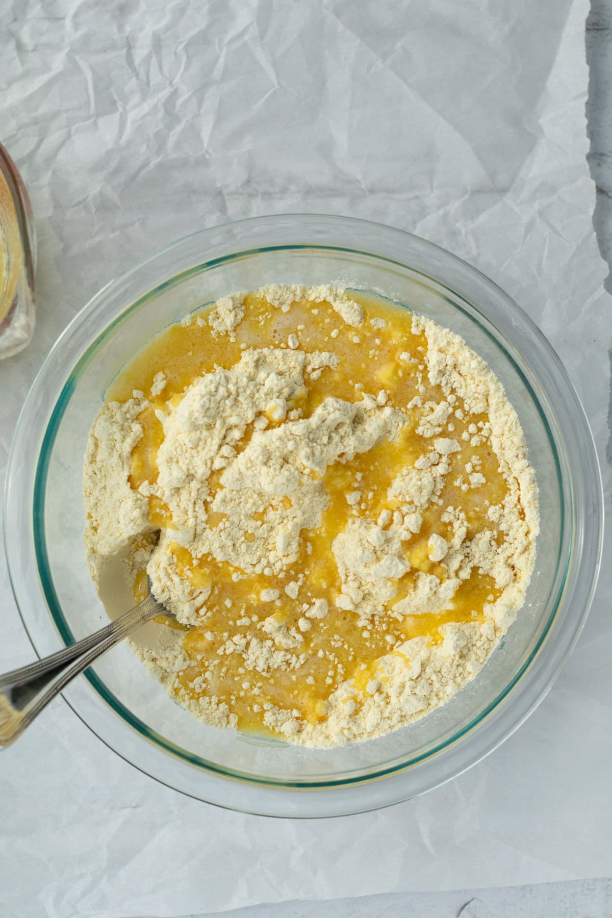 melted butter and cake mix in a glass bowl
