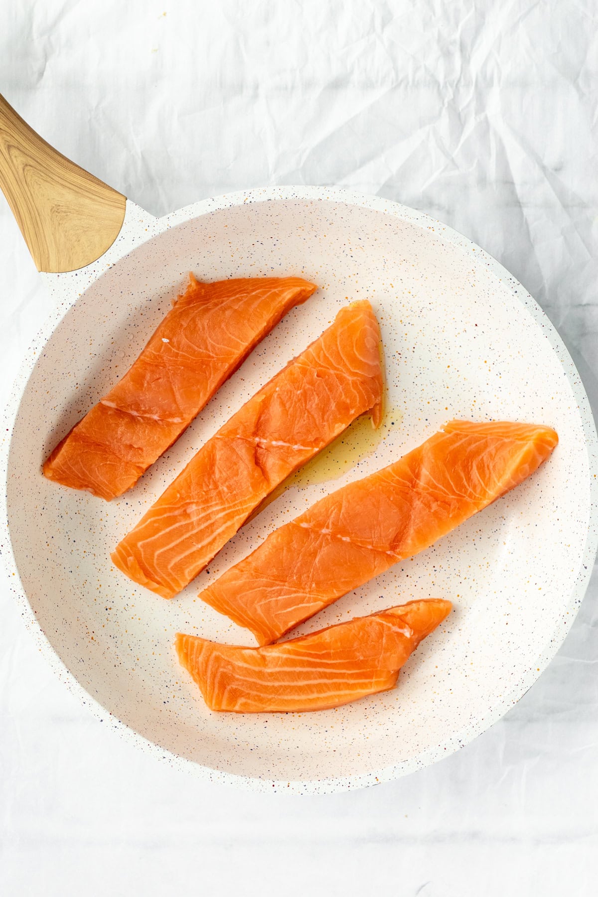 salmon cooking in a pan