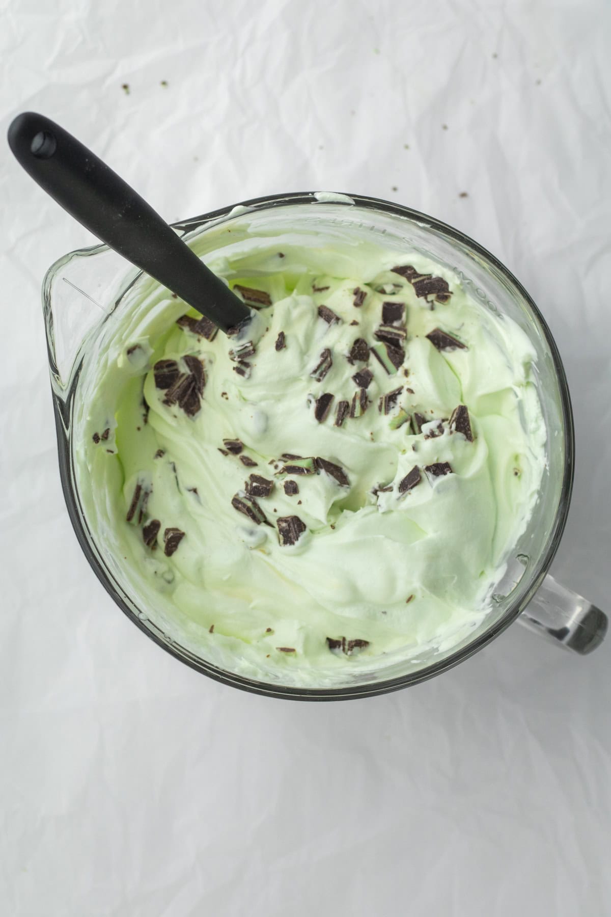 adding chocolate chips to the ice cream base