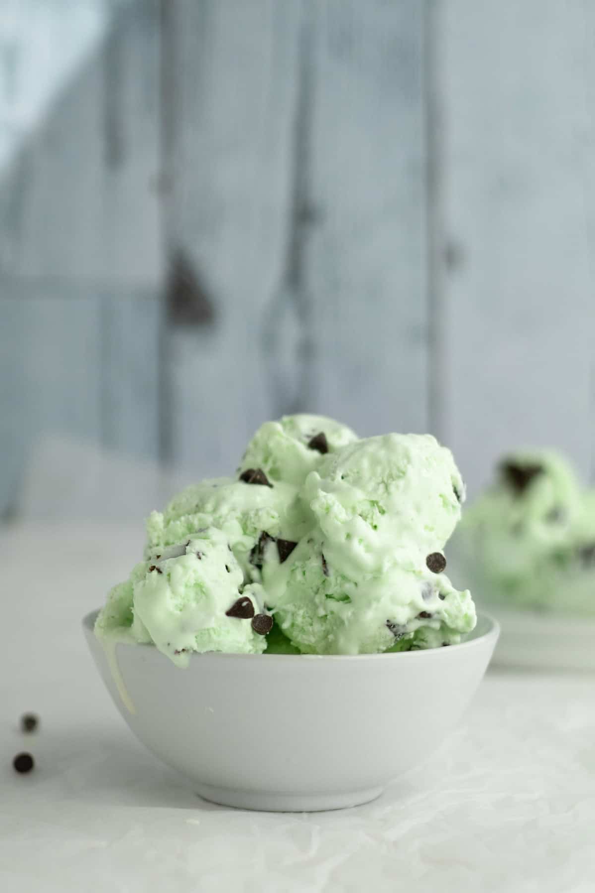 no churn mint chocolate chip ice cream in a white bowl