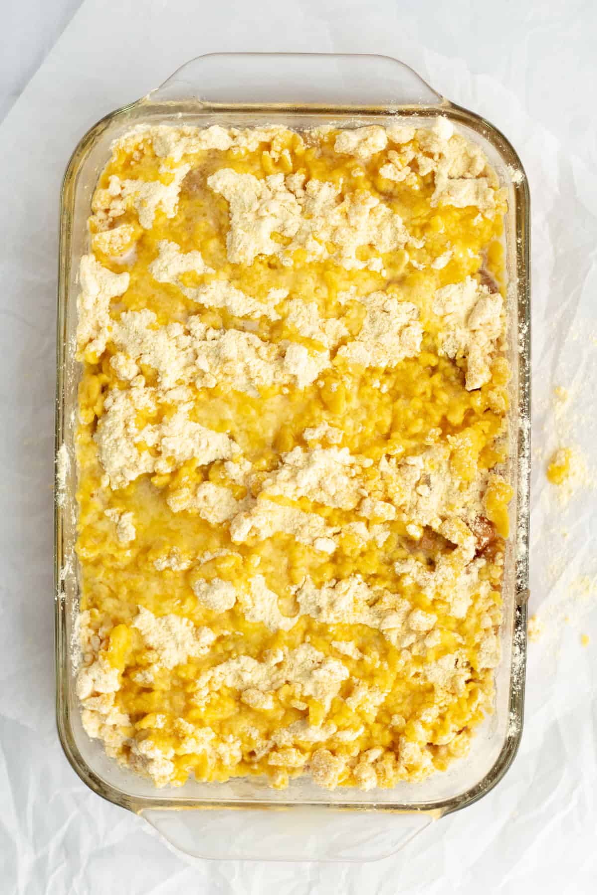 melted butter and cake mix on top of apples