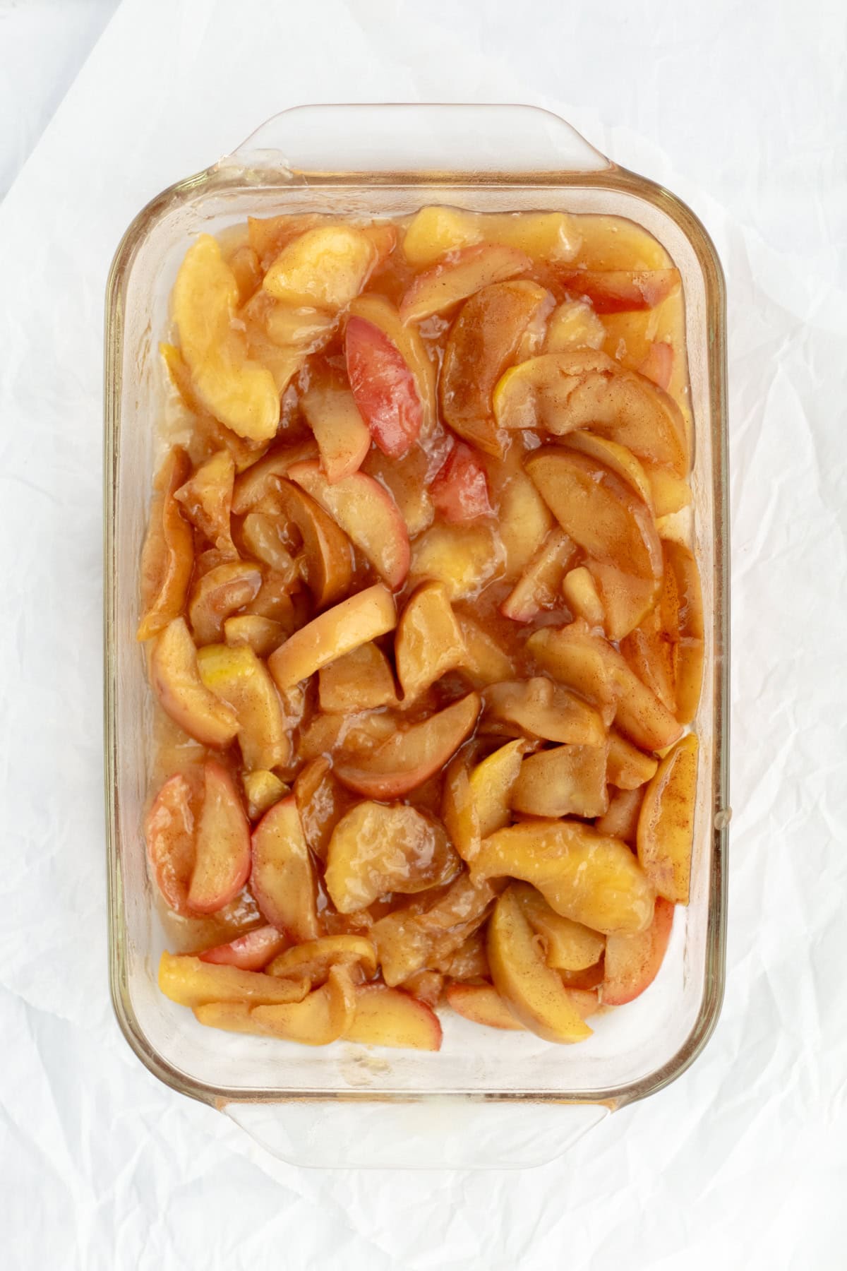 apple pie filling in a glass baking dish
